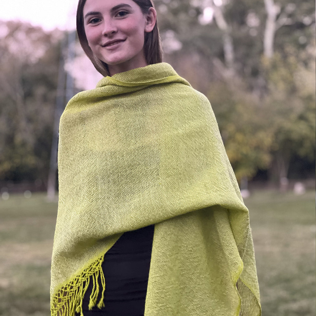 Pampa Neon lightweight wool ruana in bright green and cream tones